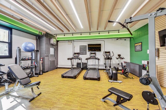 workout area featuring hardwood / wood-style floors