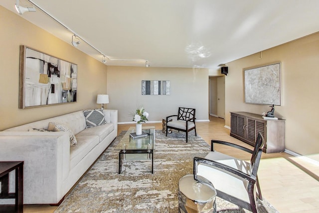 living room featuring track lighting and light hardwood / wood-style floors