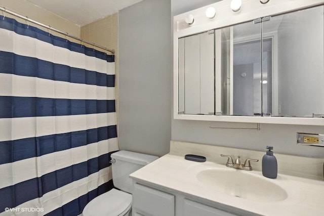 6700 S S Shore Dr Unit 3J, Chicago, IL 60649 - bathroom with a shower with shower curtain, toilet, and vanity