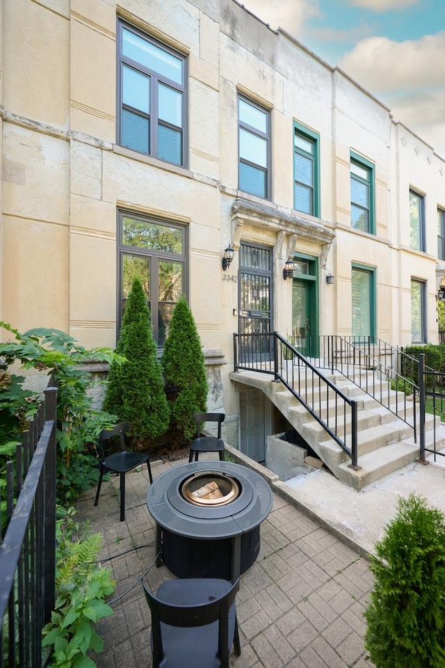 doorway to property with a patio