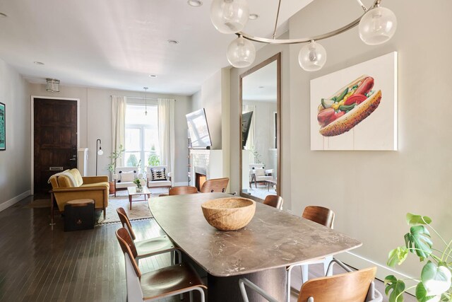 dining space with dark hardwood / wood-style floors