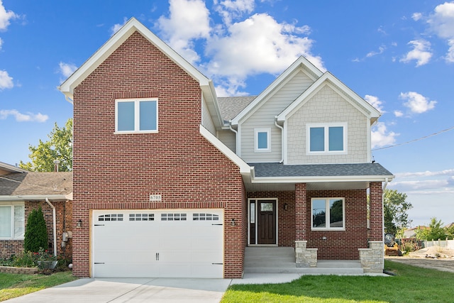 view of front of home with a garage and a front lawn