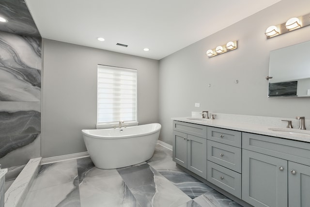 bathroom featuring vanity and a bathing tub