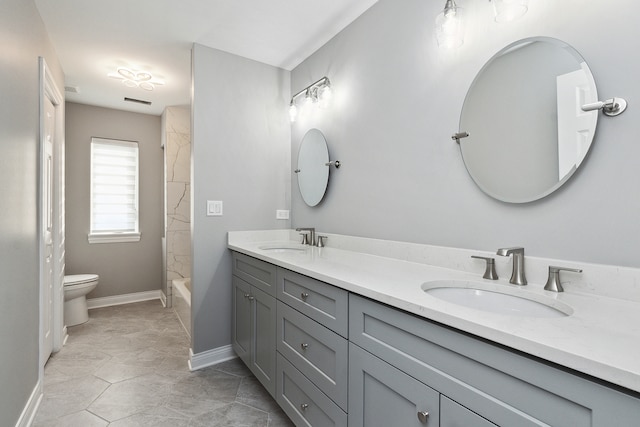 full bathroom featuring vanity, toilet, and bathtub / shower combination