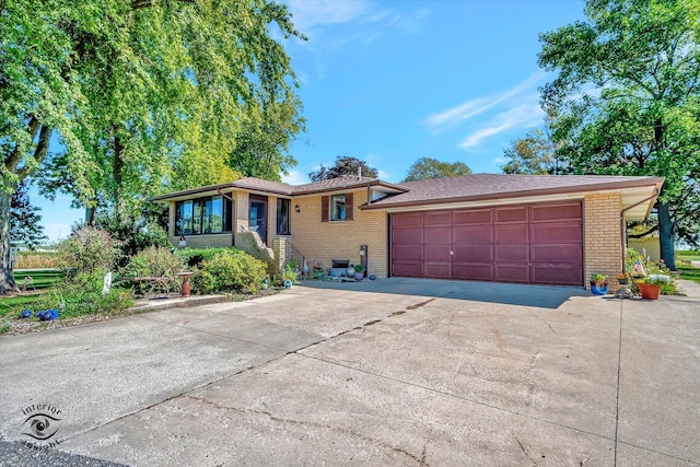 ranch-style house featuring a garage