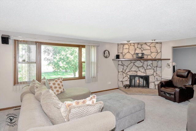 carpeted living room featuring a textured ceiling, a fireplace, and a wealth of natural light