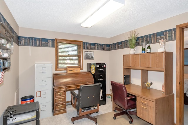 office area featuring light colored carpet and a textured ceiling