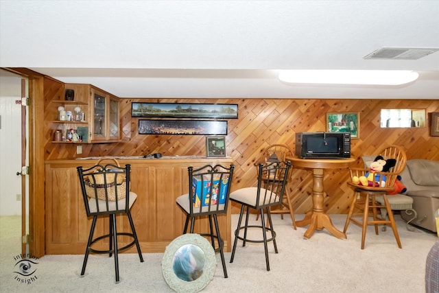 bar with wooden walls and light carpet