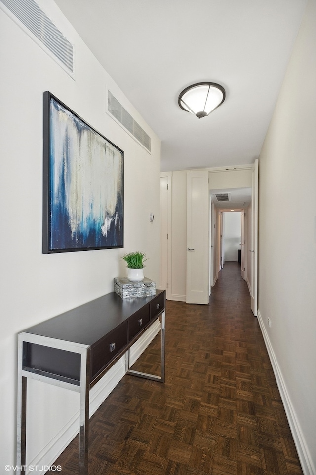 hallway featuring dark parquet floors