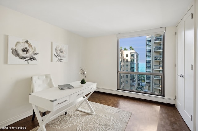 office area featuring dark parquet flooring and a baseboard radiator