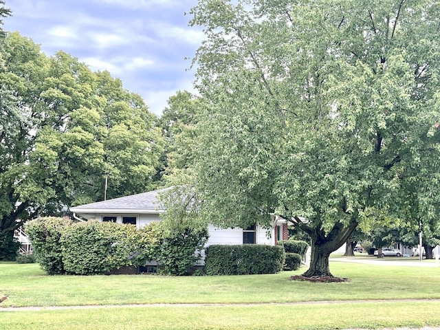 view of property exterior featuring a yard