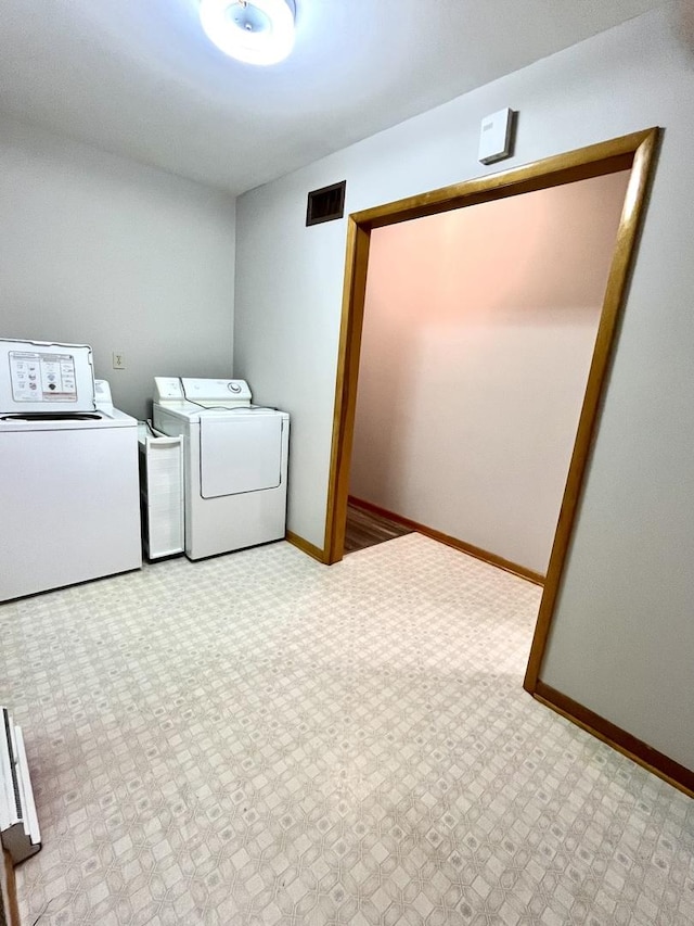 laundry room with independent washer and dryer