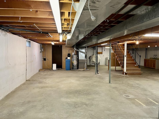 basement with gas water heater and heating unit