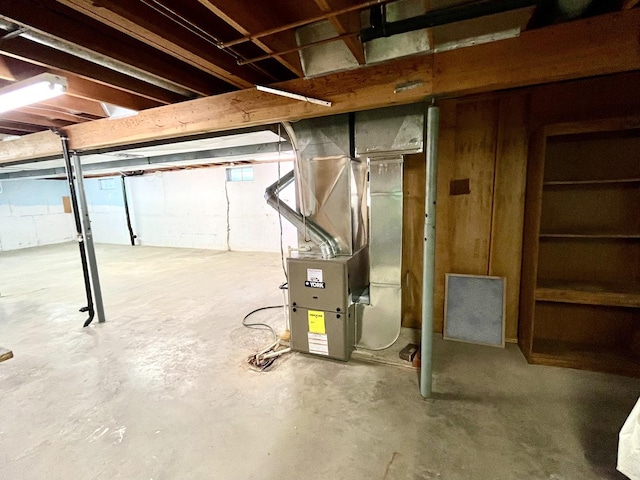 basement featuring heating unit