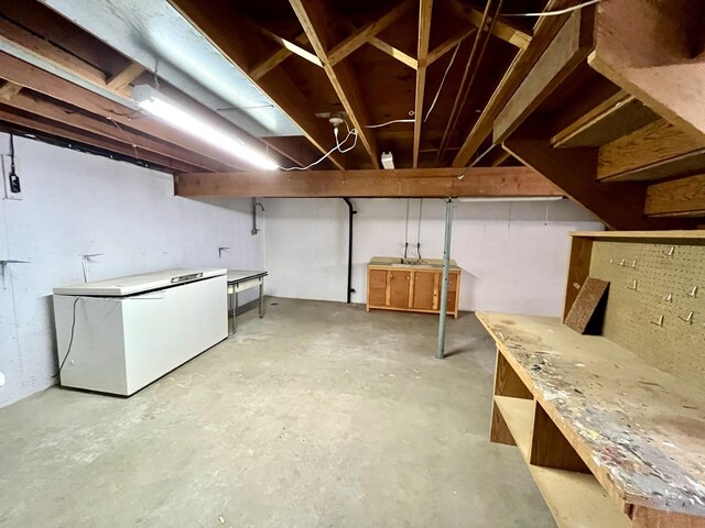 basement with fridge