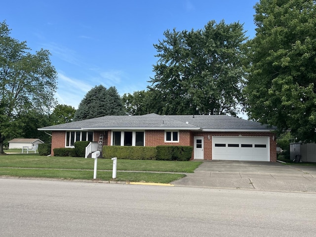 view of front of home with a garage and a front yard