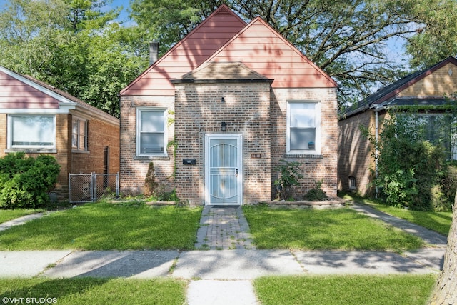 bungalow with a front yard