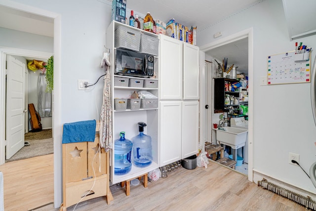 kitchen with white cabinetry and light wood-type flooring