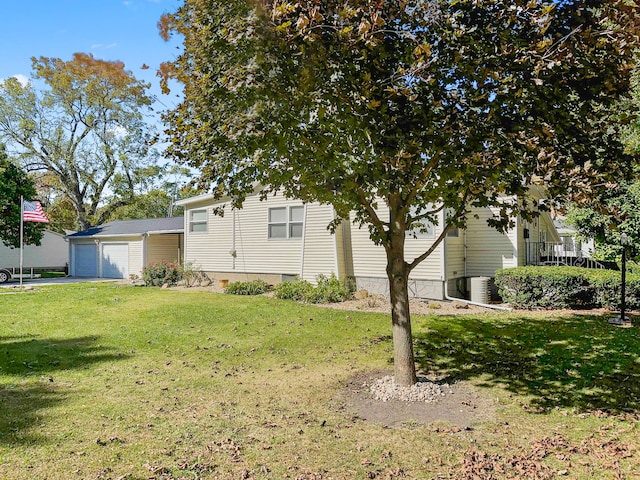 exterior space featuring a front yard and a garage