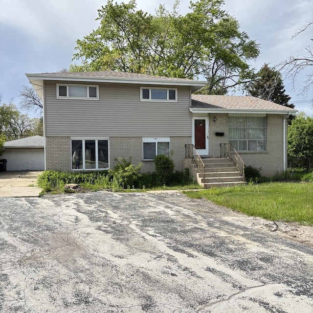 137 Julie Dr, Glenview, IL 60025 - split level home featuring brick siding and a garage