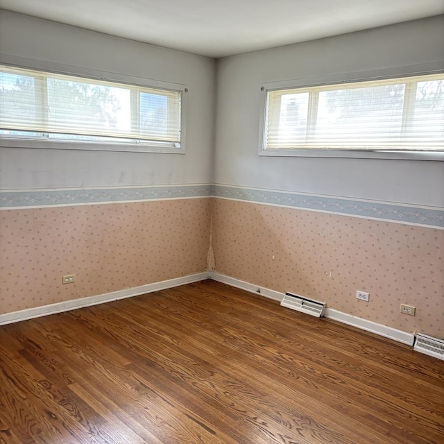 137 Julie Dr, Glenview, IL 60025 - unfurnished room with wood finished floors, wallpapered walls, and baseboards