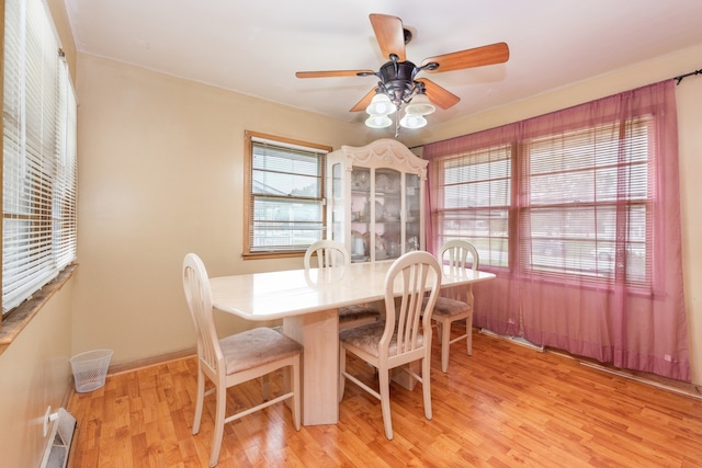 dining space featuring light hardwood / wood-style flooring and ceiling fan