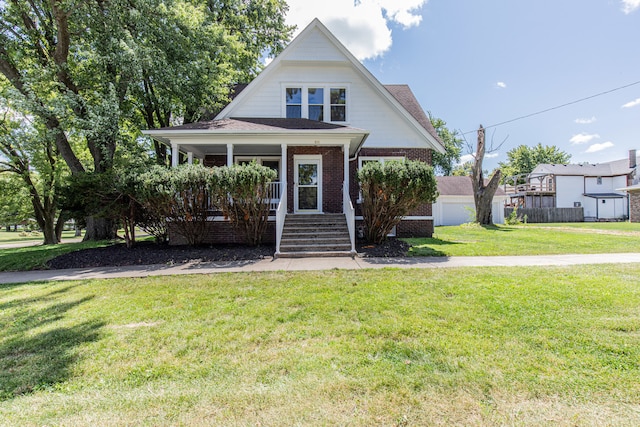 view of front of property featuring a porch and a front yard