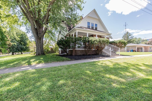 view of front of property featuring a porch and a front lawn