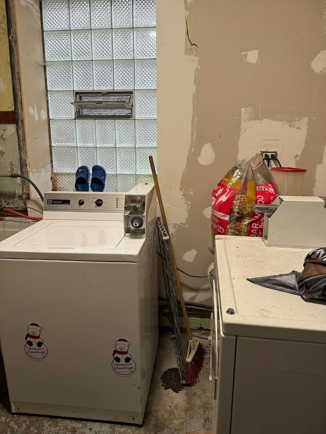 washroom with washing machine and clothes dryer