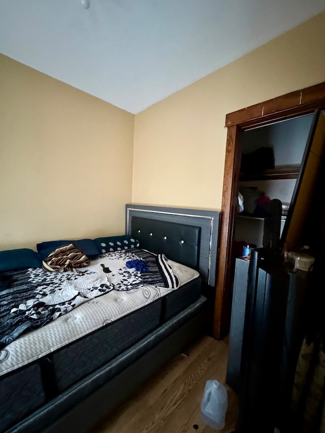 bedroom with hardwood / wood-style flooring