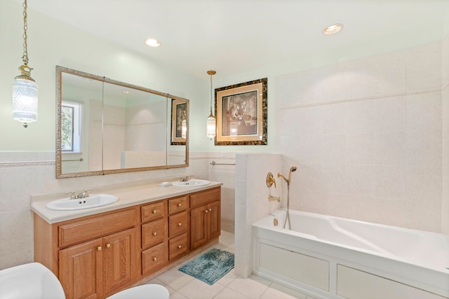 bathroom featuring tile walls, tile patterned floors, dual vanity, and a bath