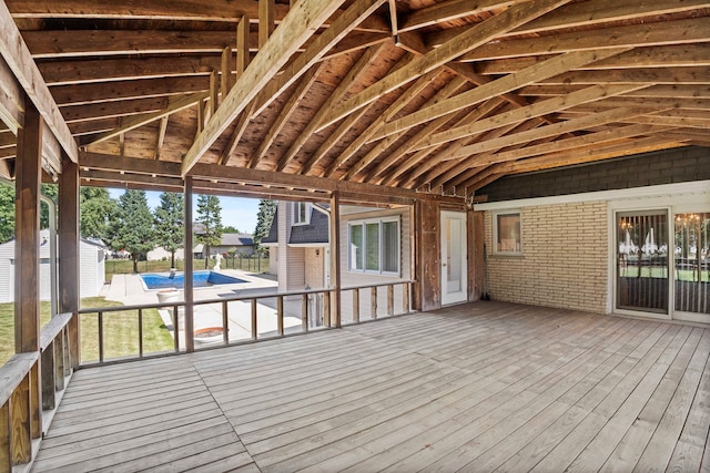 deck featuring a covered pool