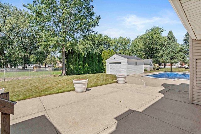 view of patio / terrace featuring an outbuilding and a garage