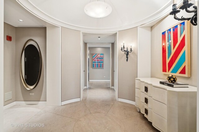 hallway featuring light tile patterned floors