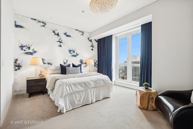 bedroom featuring carpet floors and baseboards