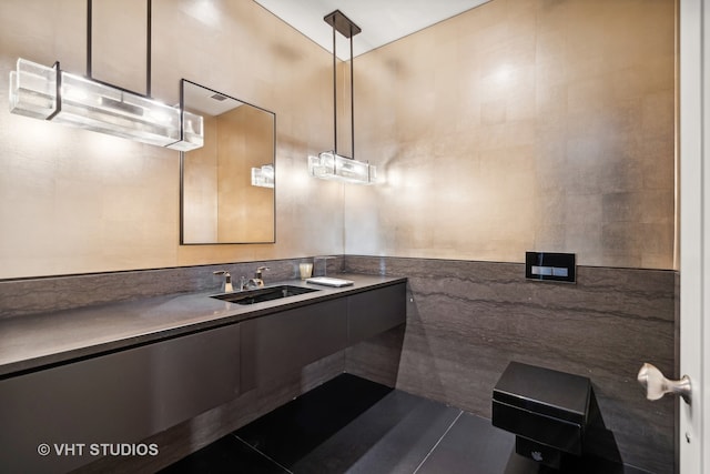 bathroom with sink, tile walls, and tile patterned flooring