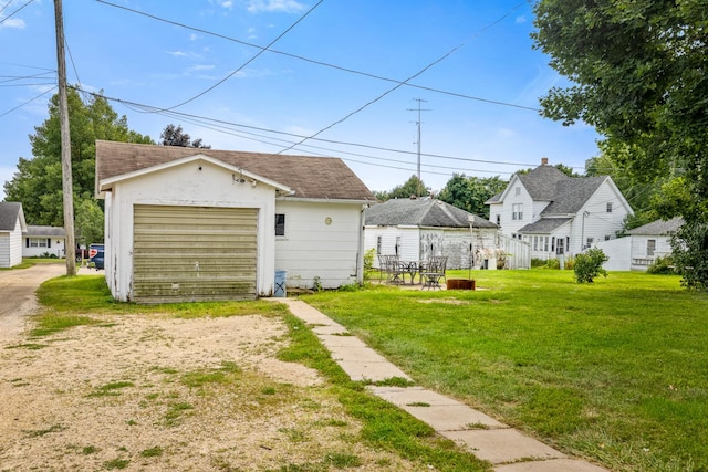 garage featuring a lawn