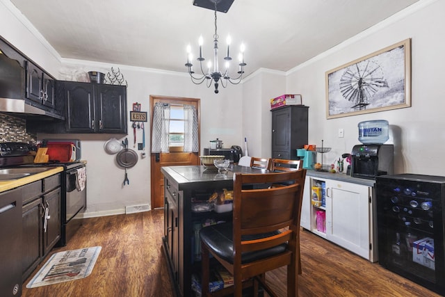 kitchen with range with electric cooktop, dark hardwood / wood-style flooring, ornamental molding, and a center island