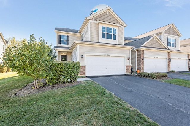 34W685 Roosevelt Ave Unit A, Saint Charles, IL 60174 - view of front of property featuring asphalt driveway, a garage, a front yard, and stone siding