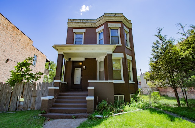 view of front of house featuring a front lawn and a porch