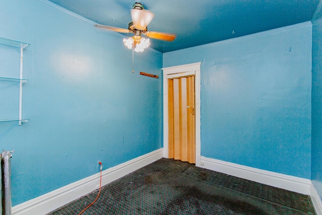 carpeted empty room with ceiling fan