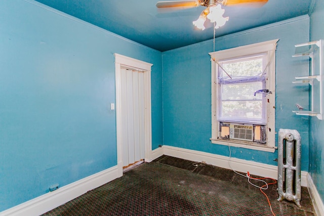 unfurnished room with crown molding, carpet, cooling unit, and ceiling fan