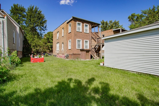 rear view of house with a lawn