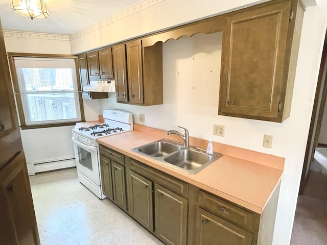 kitchen featuring sink, white gas range, and a baseboard heating unit