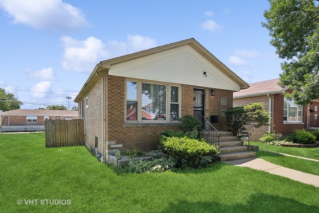 bungalow-style home with a front yard