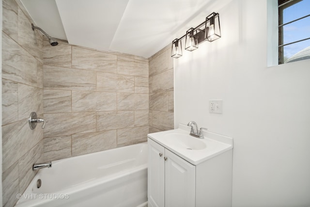 bathroom featuring vanity and tiled shower / bath combo