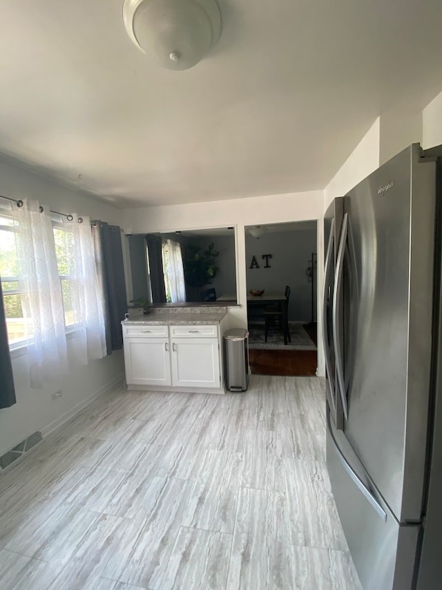 laundry room with light hardwood / wood-style floors