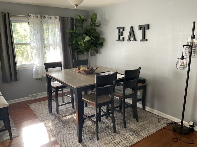 dining area with hardwood / wood-style floors