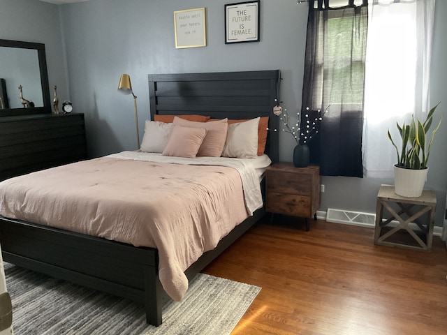 bedroom with wood-type flooring