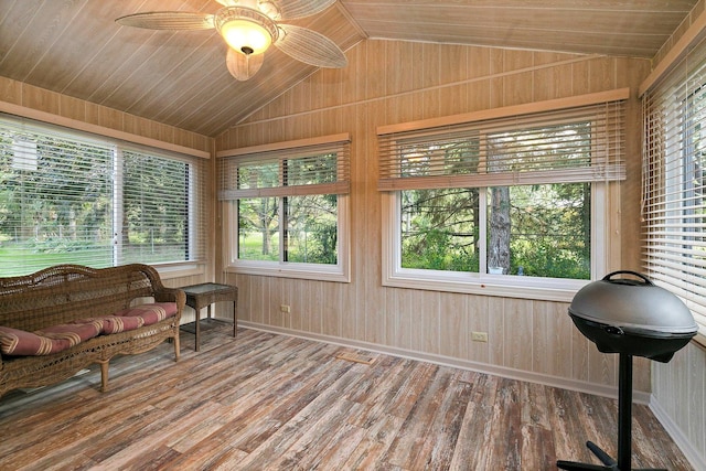 sunroom / solarium featuring wood ceiling, ceiling fan, and lofted ceiling